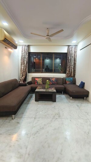 Living Room in 2 BHK Apartment at Rustomjee Elanza, Malad West – for Rent