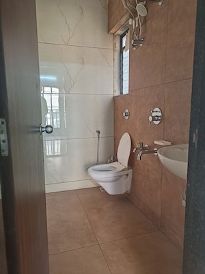 Bathroom in 1 BHK Apartment at Raunak Unnathi Woods, Ghodbunder Road – for Sale