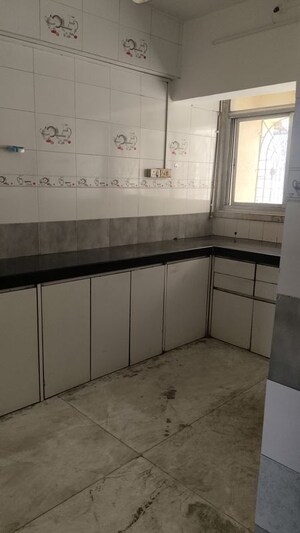 Kitchen in 2 BHK Apartment at Nav Sarswati Sadan Apartment, Naupada – for Rent