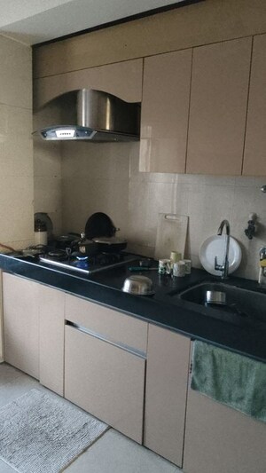 Kitchen in 2.5 BHK Apartment at Anmol Heights, Naupada – for Sale