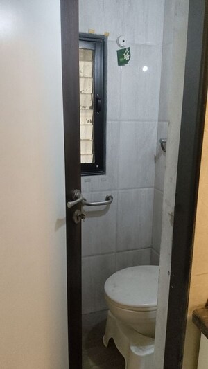 Bathroom in 2.5 BHK Apartment at Anmol Heights, Naupada – for Sale