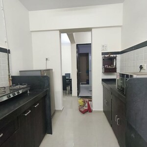 Kitchen in 1 BHK Apartment at Raunak Unnathi Woods Phase 7 A And B, Ghodbunder Road – for Rent