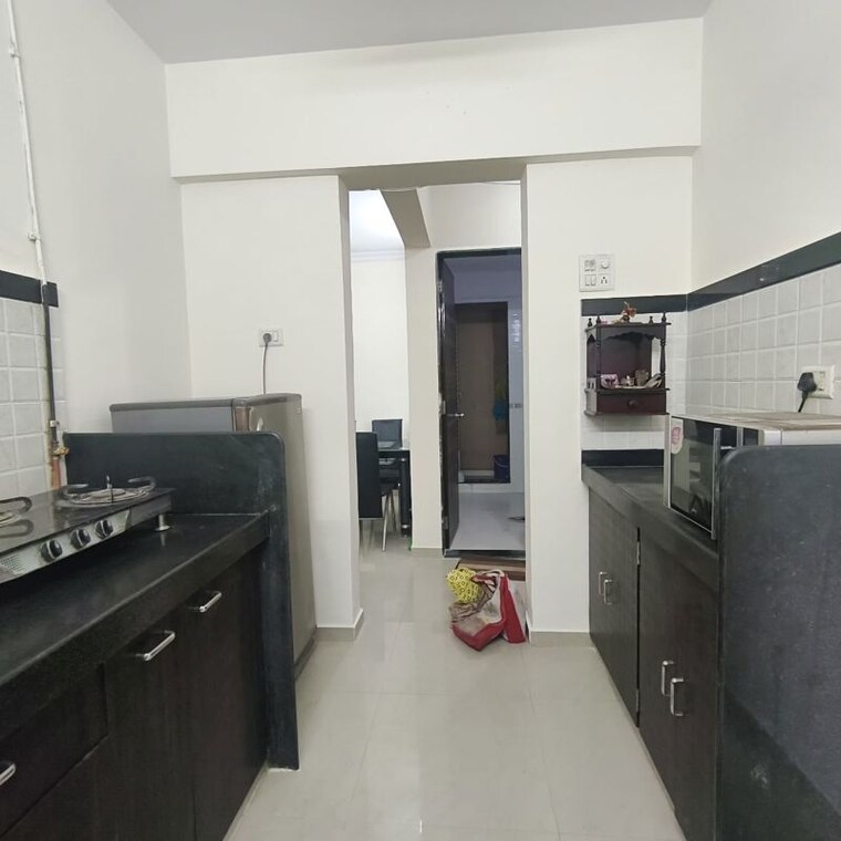 Kitchen, raunak-unnathi-woods-phase-7-a-and-b 1 Bedroom 410 Sq.Ft. Apartment In Ghodbunder Road Thane 10237258