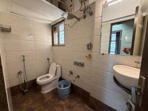 Bathroom in 2 BHK Apartment at Kanakia Spaces Niharika, Manpada – for Rent
