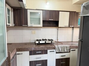 Kitchen in 2 BHK Apartment at Kanakia Spaces Niharika, Manpada – for Rent