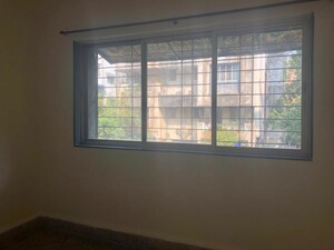 Bedroom in 2 BHK Apartment at Guru Ganesh Nagar Society, Kothrud – for Rent
