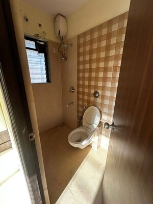 Bathroom in 2 BHK Apartment at Unnathi Woods Phase 3, Ghodbunder Road – for Rent