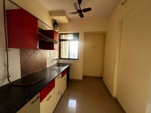 Kitchen in 2 BHK Apartment at Puranik Hometown, Ghodbunder Road – for Rent