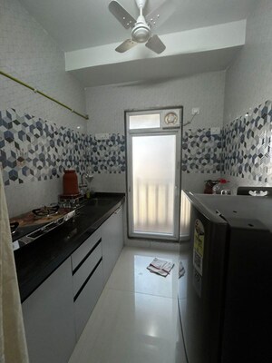 Kitchen in 1 BHK Apartment at Raunak Bliss, Ghodbunder Road – for Rent