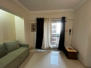 Living Room in 1 BHK Apartment at Raunak Bliss, Ghodbunder Road – for Rent
