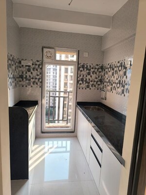 Kitchen in 1 BHK Apartment at Raunak Bliss, Ghodbunder Road – for Sale