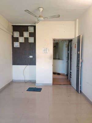 Living Room in 1 BHK Apartment at Rishabh Heights CHS, Dombivli West – for Sale