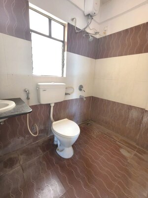 Bathroom in 3 BHK Apartment at Kolte Patil Margosa Heights, Mohammadwadi – for Rent