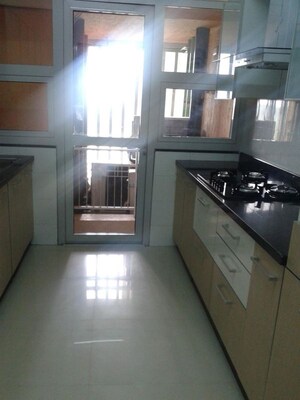 Kitchen in 2 BHK Apartment at Omkar Alta Monte, Malad East – for Rent
