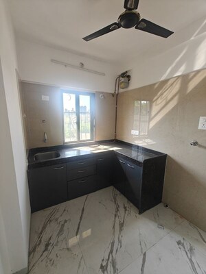 Kitchen in 2 BHK Apartment at Sach 9 Uma Ishaan Apartment, Matunga East – for Sale