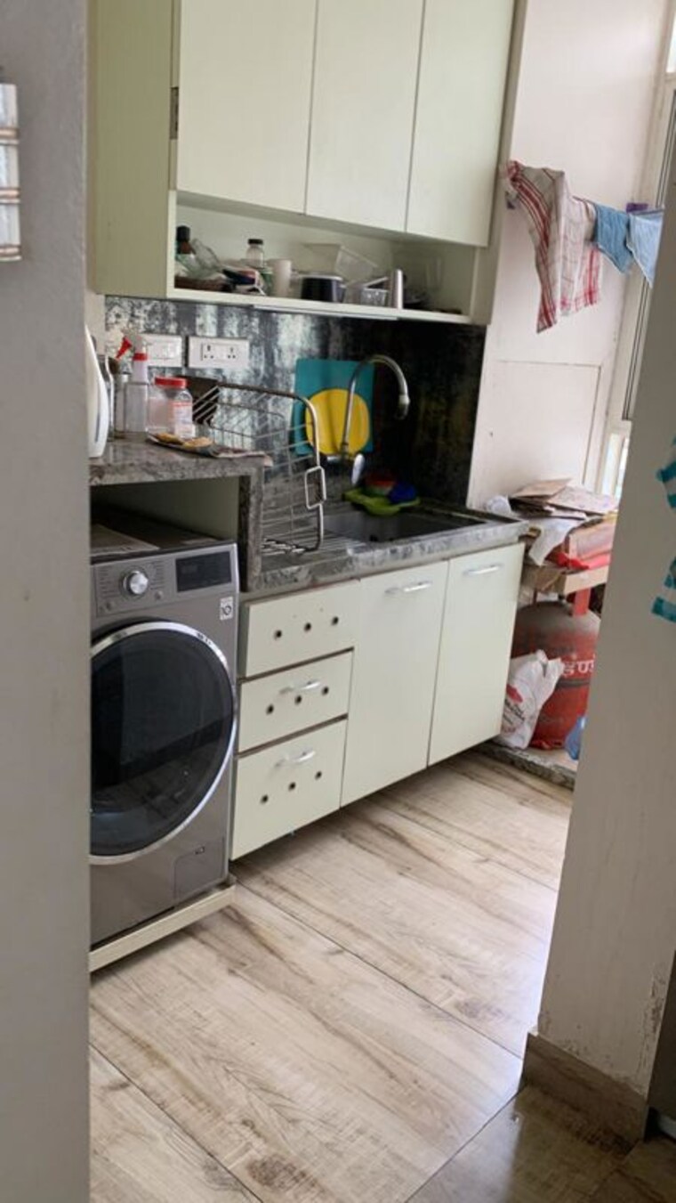 Kitchen, unique-youtopia 2 Bedroom 757 Sq.Ft. Apartment In Kharadi Pune 10243391