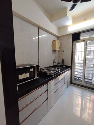 Kitchen in 2 BHK Apartment at RDC Pinewood, Thane West – for Sale