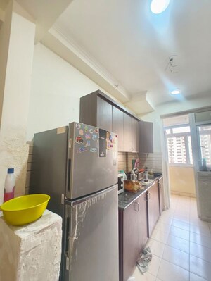 Living Room in 2 BHK Apartment at Aims Golf City, Sector 75 – for Rent