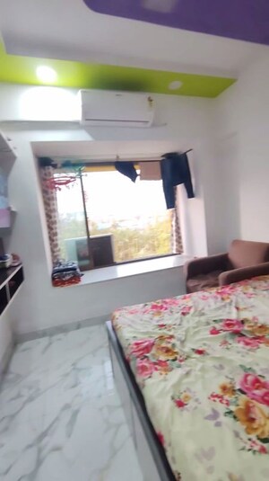 Bedroom in 1 BHK Apartment at Lokhandwala Riviera Tower, Kandivali East – for Sale