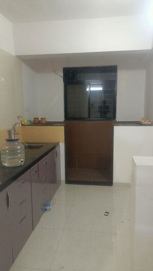 Kitchen in 2 BHK Apartment at Royal Ishana, Thergaon – for Rent