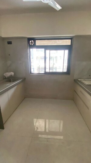Kitchen in 2 BHK Apartment at Prakash Zindagi CHS, Khar West – for Sale