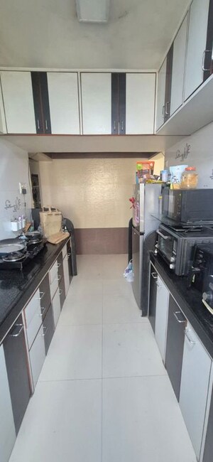 Kitchen in 2 BHK Apartment at Lokhandwala Whispering Palms, Kandivali East – for Rent