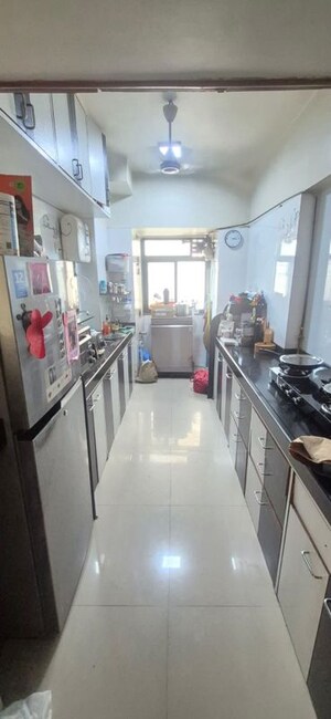 Kitchen in 2 BHK Apartment at Lokhandwala Whispering Palms, Kandivali East – for Rent