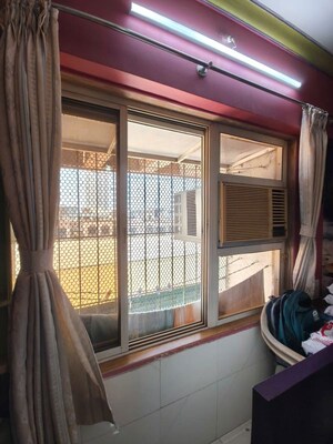 Living Room in 1 BHK Apartment at JPV Pratap Liberty One, Malad West – for Rent