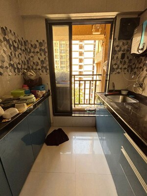 Kitchen in 1 BHK Apartment at Raunak Unnathi Woods Phase 6, Ghodbunder Road – for Rent