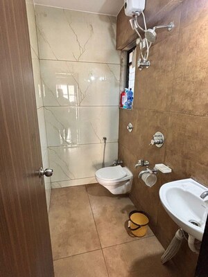 Bathroom in 1 BHK Apartment at Raunak Unnathi Woods Phase 6, Ghodbunder Road – for Rent