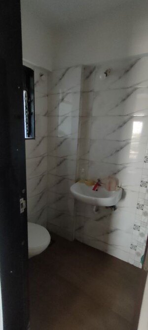 Bathroom in 1 BHK Apartment at Oyster Hiral Legacy, Kandivali West – for Rent