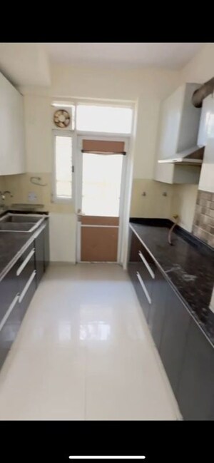Kitchen in 3 BHK Apartment at Amrapali Heartbeat City, Sector 107 – for Rent