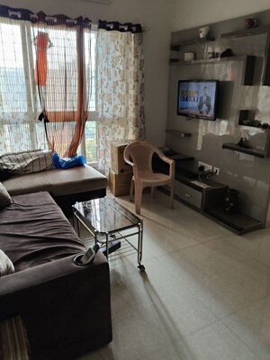 Living Room in 2 BHK Apartment at Lodha Amara, Kolshet Road – for Rent