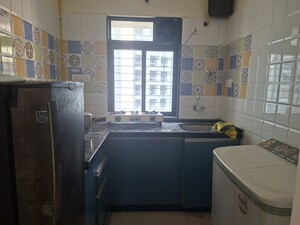 Kitchen in 1 BHK Apartment at Haware Dahlia, Kasarvadavali – for Rent