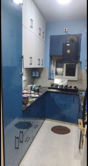 Kitchen in 2 BHK Apartment at Raheja Vedaanta, Sector 108 – for Sale