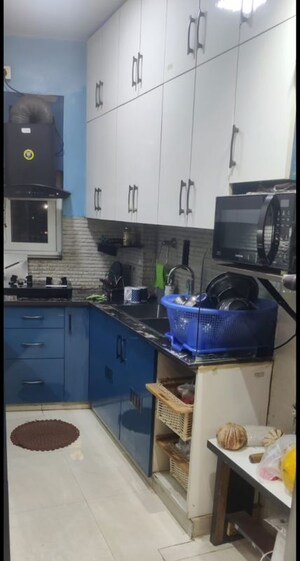 Kitchen in 2 BHK Apartment at Raheja Vedaanta, Sector 108 – for Sale