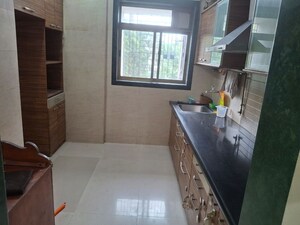 Kitchen in 2 BHK Apartment at Vardhman Gardens, Balkum Pada – for Rent