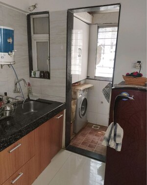 Kitchen in 2 BHK Apartment at Aakash Ganga Apartment, Pimple Saudagar – for Rent