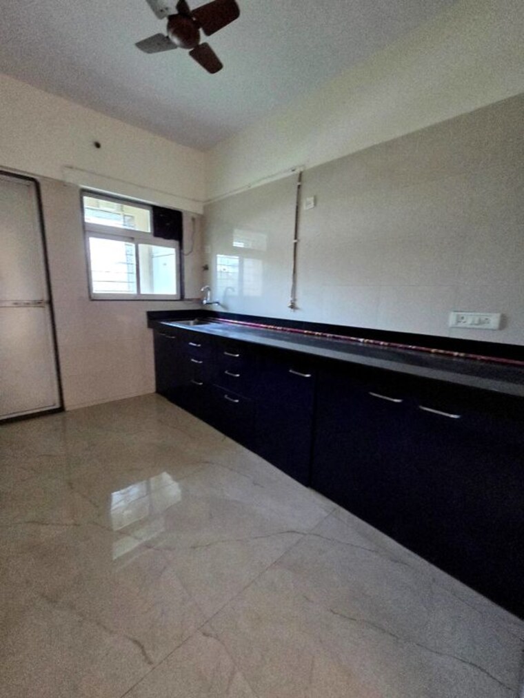 Kitchen, cosmos-habitat 2 Bedroom 700 Sq.Ft. Apartment In Majiwada Thane 10251412