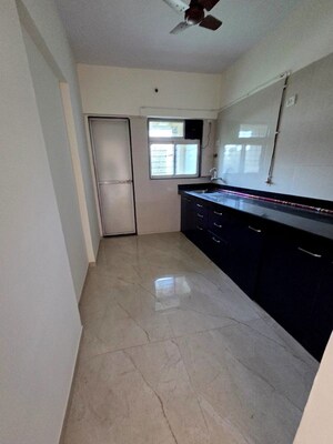 Kitchen in 2 BHK Apartment at Cosmos Habitat, Majiwada – for Rent