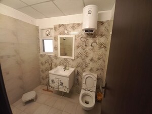 Bathroom in 3.5 BHK Apartment at Elite Golf Green, Sector 79 – for Rent