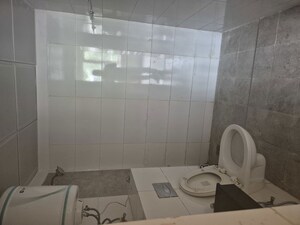 Bathroom in 3 BHK Apartment at Mahindra Aura, Sector 110a – for Rent