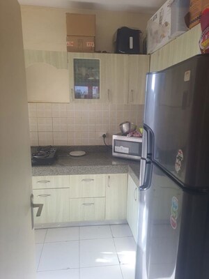 Kitchen in 3 BHK Apartment at Mahindra Aura, Sector 110a – for Rent