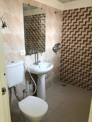 Bathroom in 2.5 BHK Apartment at Mahagun My Woods, Sector 16c Greater Noida – for Rent