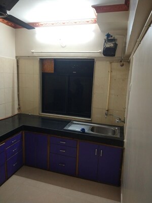 Kitchen in 3 BHK Apartment at Our Home CHS, Andheri West – for Rent