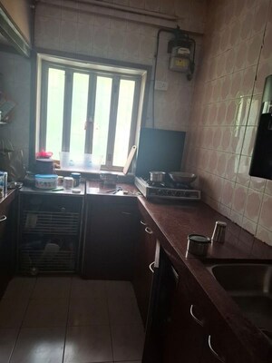 Kitchen in 2 BHK Apartment at Gokuldham Complex, Goregaon East – for Rent