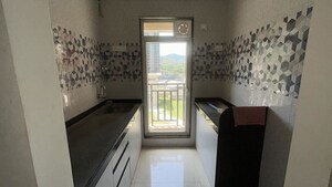 Kitchen in 1 BHK Apartment at Raunak Bliss B2, Ghodbunder Road – for Sale