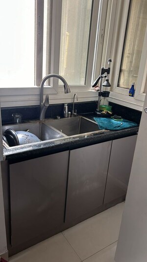 Kitchen in 3 BHK Apartment at Rani Aakriti Shantiniketan, Sector 143 – for Sale