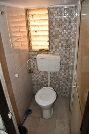 Bathroom in 1 BHK Apartment at Om Sai Chhatra Residency, Navade – for Rent