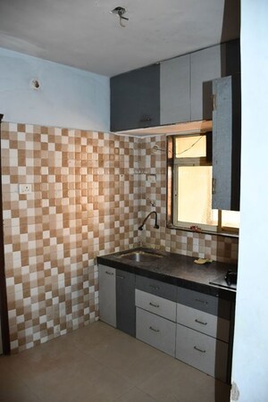 Kitchen in 1 BHK Apartment at Om Sai Chhatra Residency, Navade – for Rent